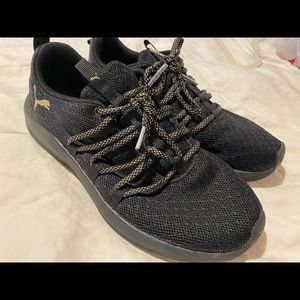 Black and gold pumas